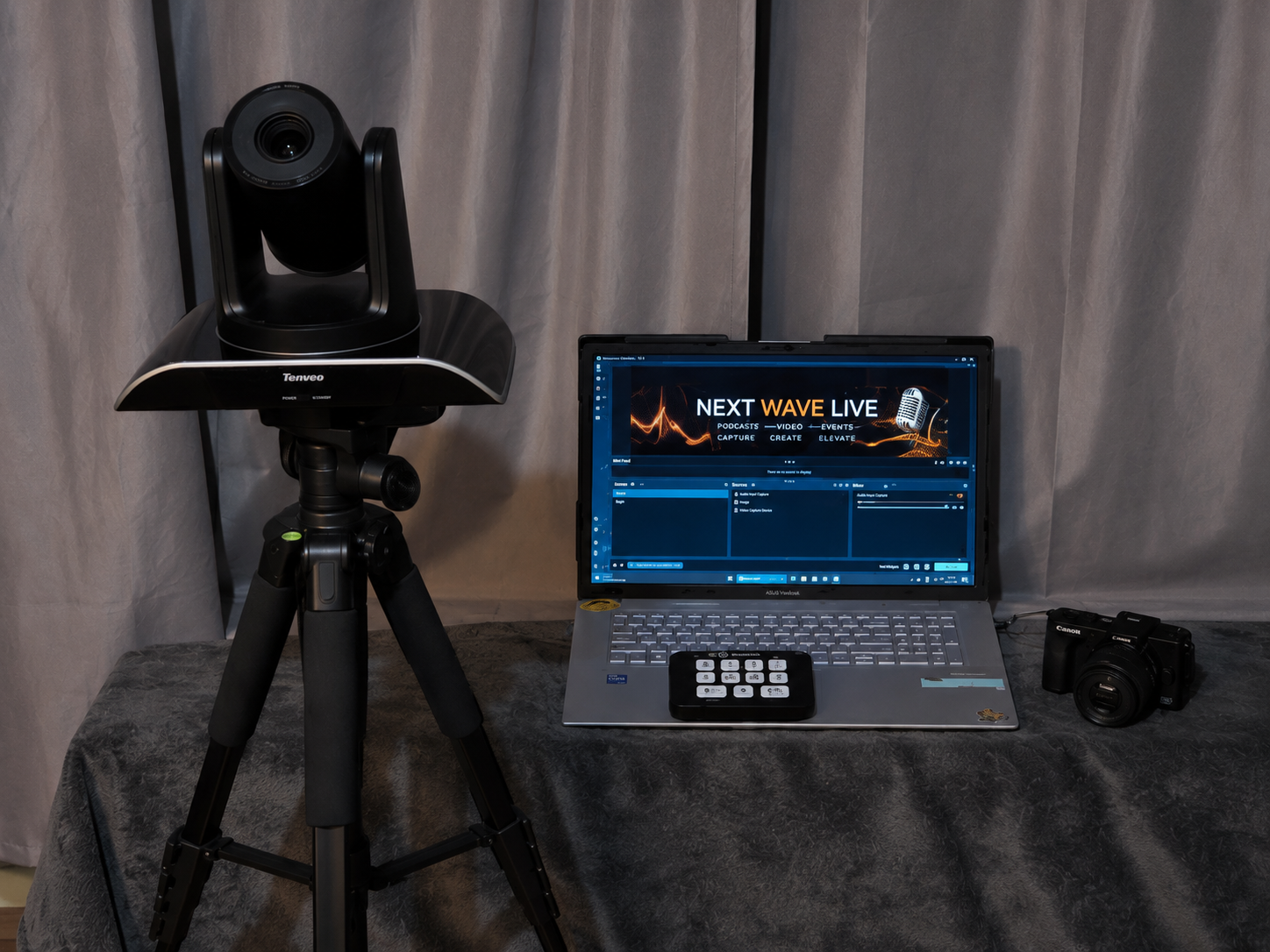 Next Wave Live video production setup with camera, laptop and controls